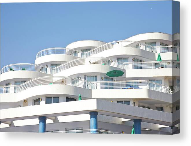 Viewpoint Canvas Print featuring the photograph Curved White Balcony Bands Under Blue by Barry Winiker