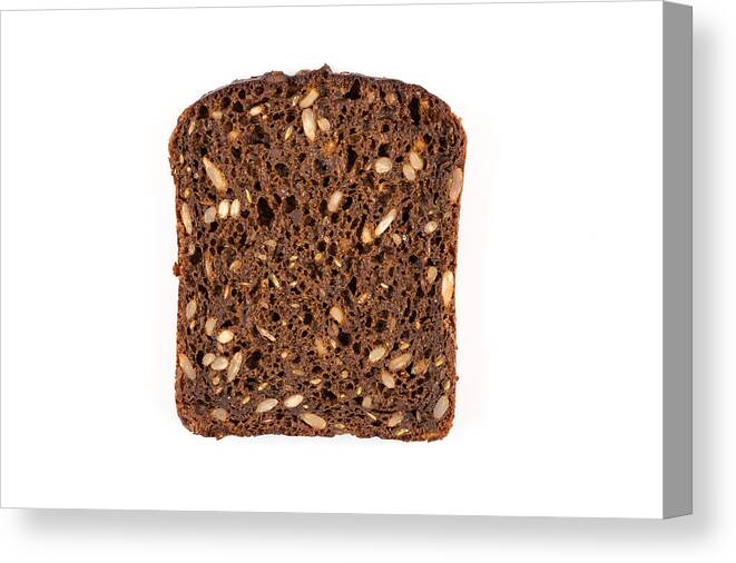 Bakery Canvas Print featuring the photograph Dark rye bread with sunflower seeds by R.Tsubin
