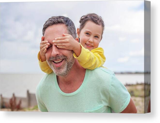 Two People Canvas Print featuring the photograph Daughter Covering Father's Eyes by Ian Hooton