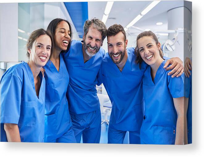 Working Canvas Print featuring the photograph Dentist's office in Barcelona. Medical workers portrait. by Tempura