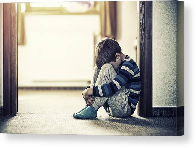 Problems Canvas Print featuring the photograph Depressed little boy sitting on the floor by Imgorthand