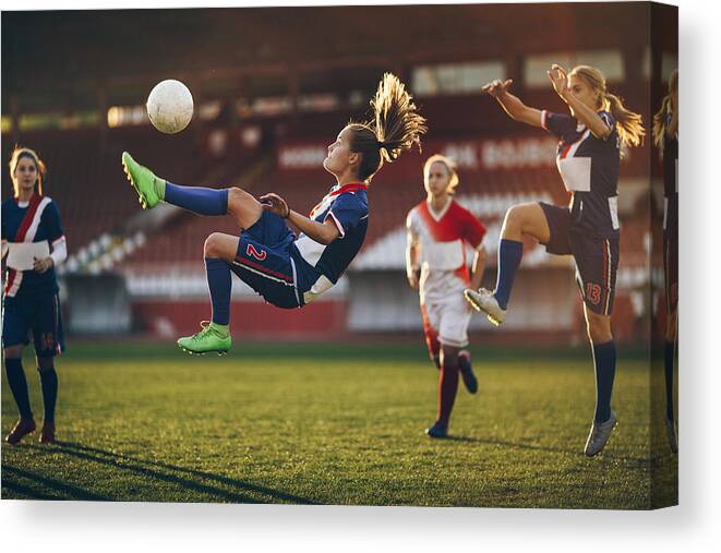 Soccer Uniform Canvas Print featuring the photograph Determined bicycle kick on a soccer match! by Skynesher