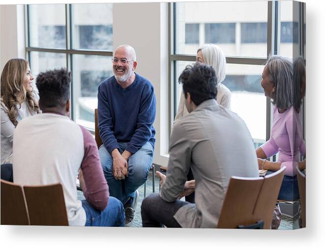 Expertise Canvas Print featuring the photograph Diverse people sit in circle and brainstorm ideas by Asiseeit