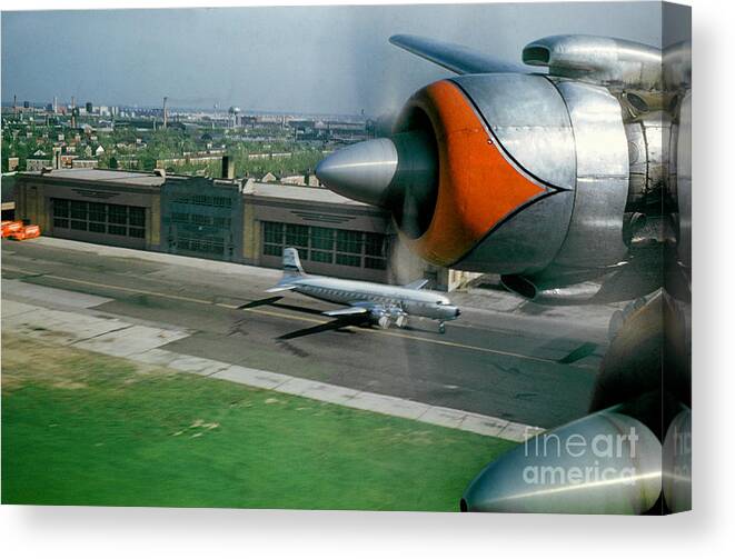 Douglas Dc-7 Canvas Print featuring the photograph Douglas DC-7 Taking off by Wernher Krutein