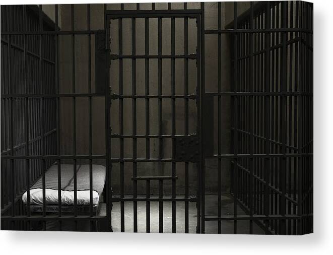 Punishment Canvas Print featuring the photograph Empty prison cell by Darrin Klimek
