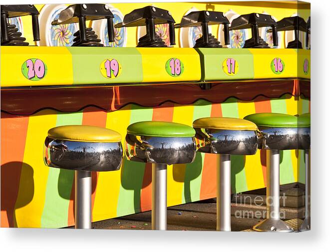 Americana Canvas Print featuring the photograph Evergreen State Fair midway game with coloful stools and squirt by Jim Corwin