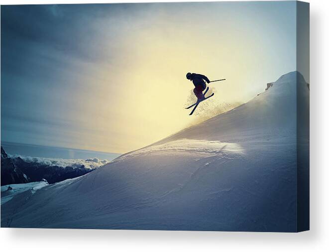 Skiing Canvas Print featuring the photograph Extreme  Freestyle snow skier jumping  Off pist back country skiing by Ultramarinfoto