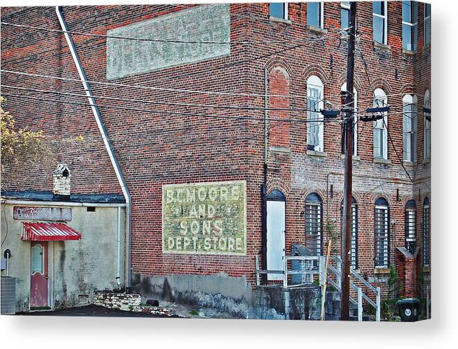 Buildings Canvas Print featuring the photograph Faded Signs by Linda Brown