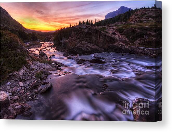 Swiftcurrent Falls Canvas Print featuring the photograph Falls at first light by Mark Kiver