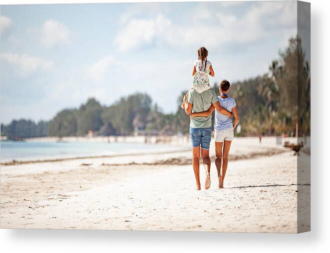Child Canvas Print featuring the photograph Family WIth One Daughter Walking on Sandy Beach by CasarsaGuru