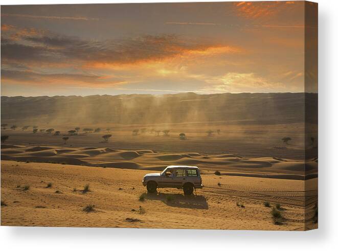 Dust Canvas Print featuring the photograph Four Wheel Driving In A Desert by Buena Vista Images