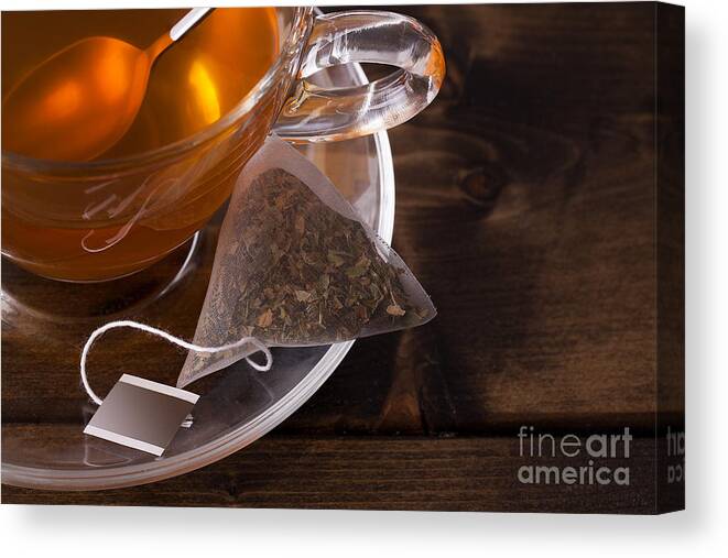 Tea Canvas Print featuring the photograph Fresh glass cup of tea by Simon Bratt