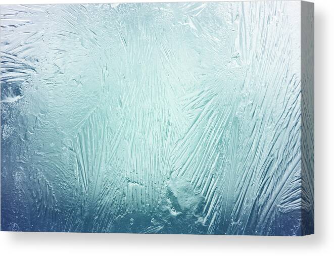 Melting Canvas Print featuring the photograph Frozen Window by Drbouz