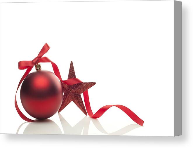 Home Decor Canvas Print featuring the photograph Graphic of red Christmas ornament, ribbon and star by Hanibaram