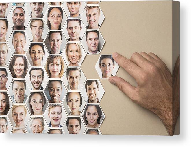 People Canvas Print featuring the photograph Grid of hexagonal portraits, hand adding new one by Dimitri Otis