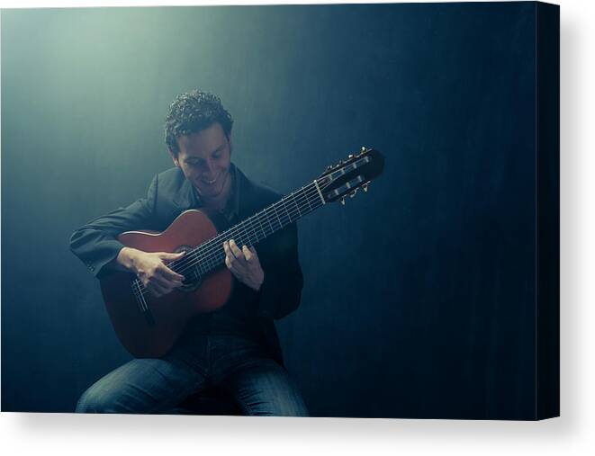 People Canvas Print featuring the photograph Guitarist Playing Instrument by Tooga