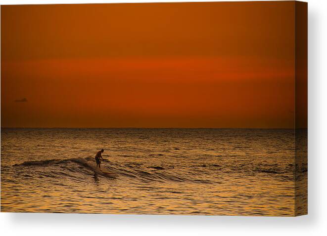 Hawaiian Canvas Print featuring the photograph Hawaiian Sunset Surfing by Tin Lung Chao