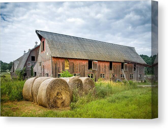 Old Barn Canvas Print featuring the photograph Hay bales and old barns by Gary Heller