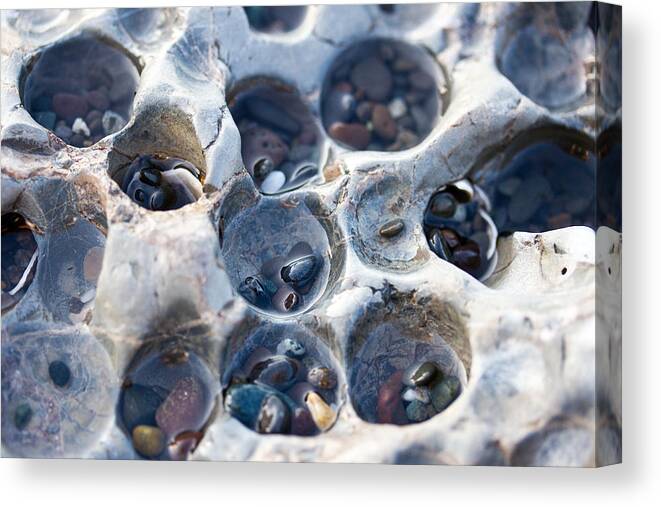 Holey Rock Canvas Print featuring the photograph Holey Rock - Ocean - Pebbles by Marie Jamieson