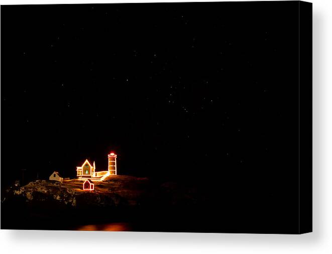 Lighthouse Canvas Print featuring the photograph Holiday Lights At Nubble Light by Jeff Sinon