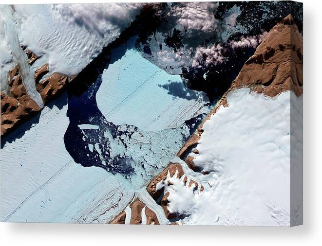 Ice Island Canvas Print featuring the photograph Ice Island From Petermann Glacier by Nasa