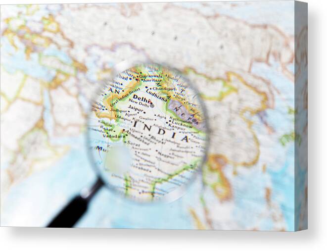 Magnifying Glass Canvas Print featuring the photograph India And Magnifying Glass by Yuji Sakai