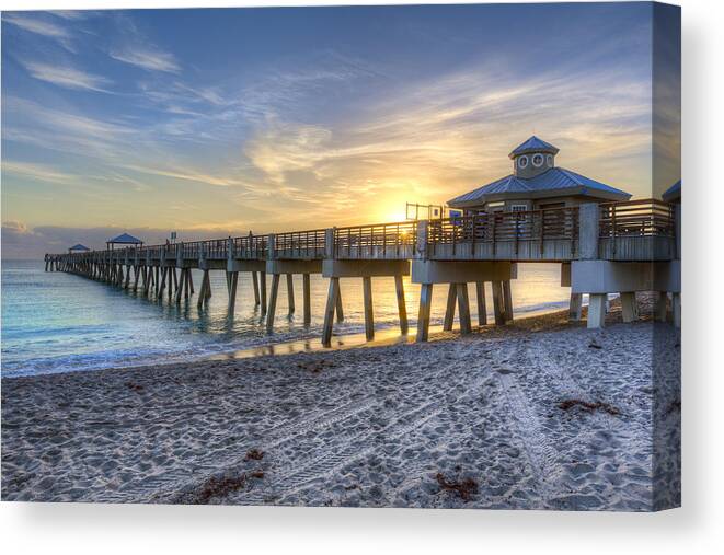 Clouds Canvas Print featuring the photograph Juno Beach Pier at Dawn by Debra and Dave Vanderlaan