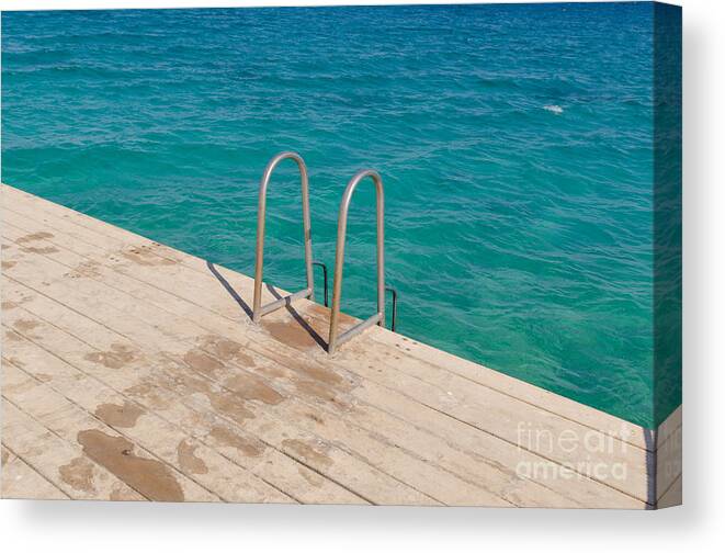 Ladder Canvas Print featuring the photograph Ladder on a wooden bridge by Nikita Buida