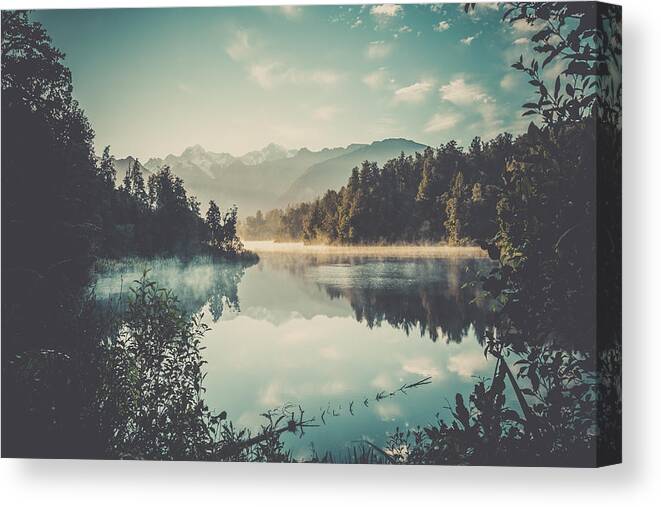 Scenics Canvas Print featuring the photograph Lake Matheson Nature Panorama at Sunrise, New Zealand by Onfokus