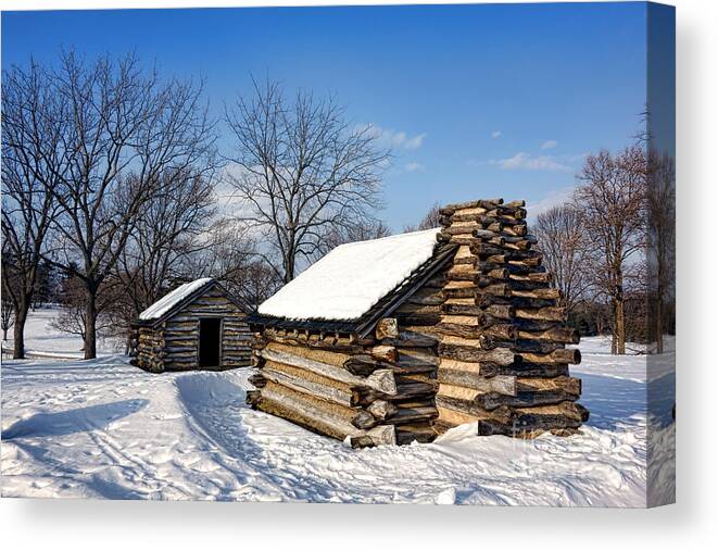 Valley Canvas Print featuring the photograph Log Cabins in Snow by Olivier Le Queinec