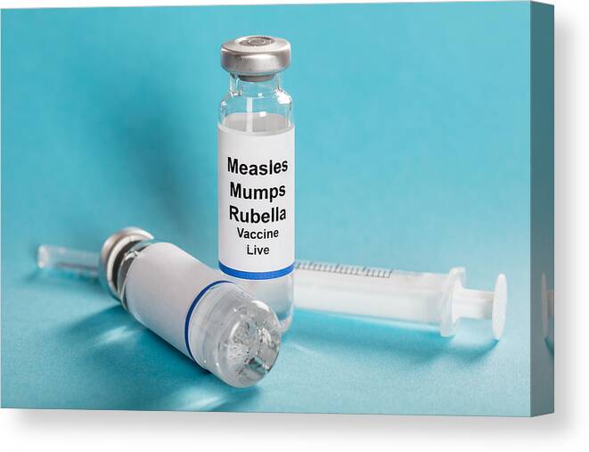 Medical Research Canvas Print featuring the photograph Measles Mumps Rubella Vaccine Vials With Syringe by AndreyPopov