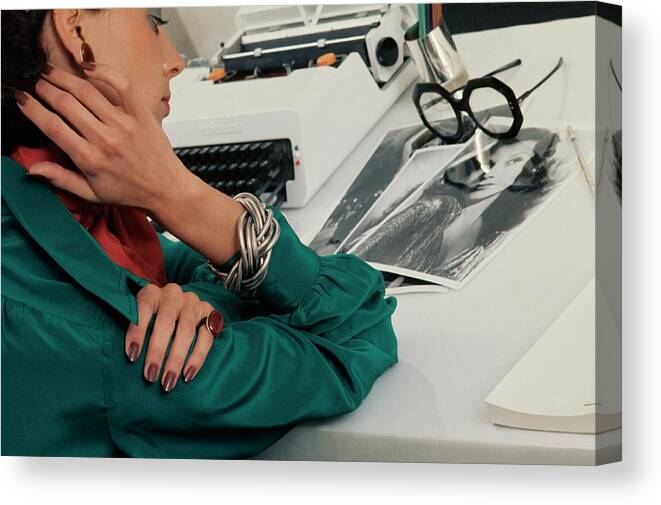 Accessories Canvas Print featuring the photograph Model Wearing Revlon Nail Polish At A Desk by Kourken Pakchanian