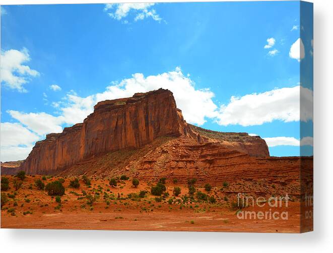 Monument Valley Canvas Print featuring the photograph Monument Valley Rock Formation and Clouds by Debra Thompson