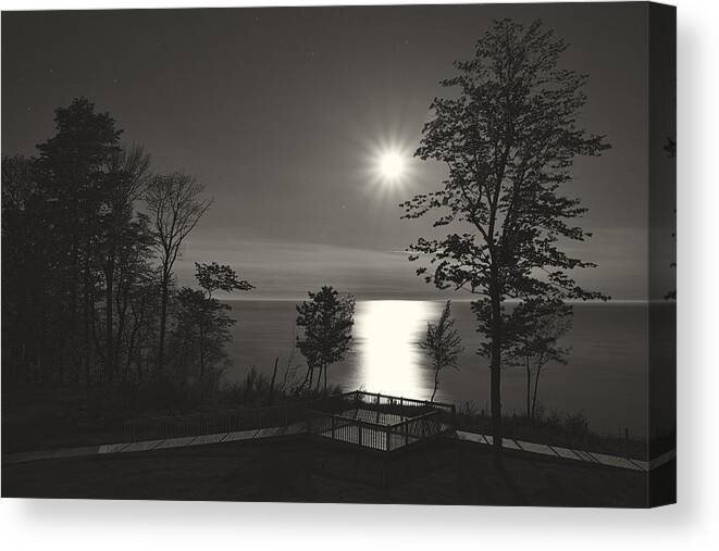 Lake Michigan Canvas Print featuring the photograph Moon over Lake Michigan in Black and White by Mary Lee Dereske