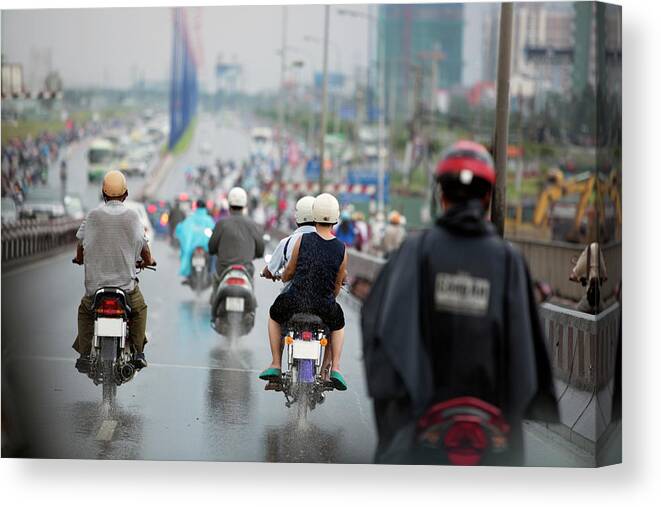Ho Chi Minh City Canvas Print featuring the photograph Motorcyclists On Road In Rain, Ho Chi by Eternity In An Instant