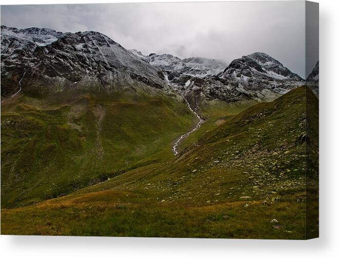 Mountain Canvas Print featuring the photograph Mountainscape with snow by Roberto Pagani