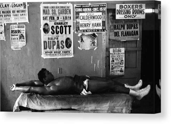 Marvin Newman Canvas Print featuring the photograph Muhammad Ali Stretching by Retro Images Archive