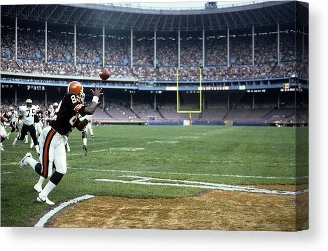 1980-1989 Canvas Print featuring the photograph New Orleans Saints v Cleveland Browns by Tony Tomsic