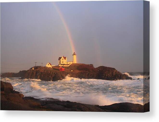 Lighthouse Canvas Print featuring the photograph Nubble Lighthouse Rainbow and High Surf by John Burk
