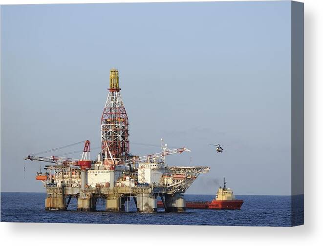 Oil Rig Canvas Print featuring the photograph Off Shore Oil Rig with Helicopter and Boat by Bradford Martin