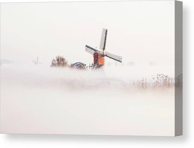 Built Structure Canvas Print featuring the photograph Old Fashioned Windmill In Misty by Arno Masse