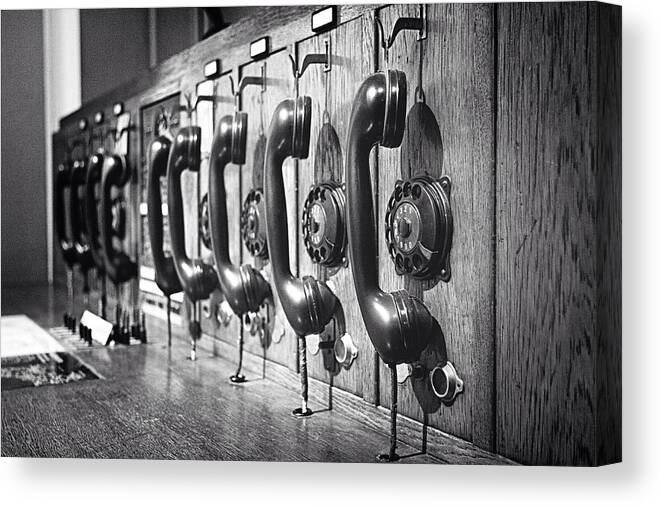 In A Row Canvas Print featuring the photograph Old-fashioned Wooden Telephone by Anja Heid / Eyeem