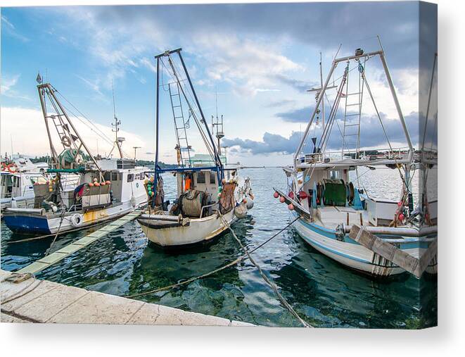 Boat Canvas Print featuring the photograph Old Fishing Boats In Evening Harbor by Andreas Berthold