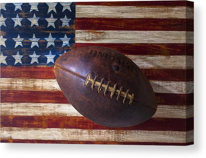 Football Canvas Print featuring the photograph Old Football On American Flag by Garry Gay