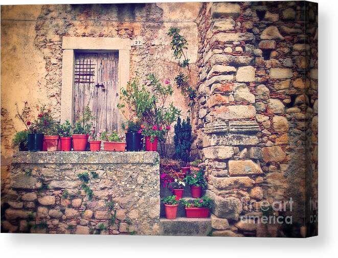 Architecture Canvas Print featuring the photograph Old Italian door with flower vases by Silvia Ganora