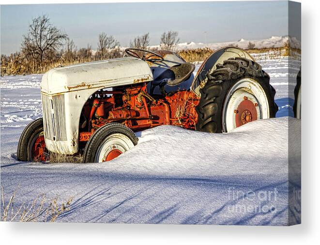 Tractor Canvas Print featuring the photograph Old Tractor in the Snow by Richard Lynch