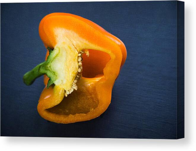 Pepper Canvas Print featuring the photograph Orange bell pepper blue texture by Matthias Hauser