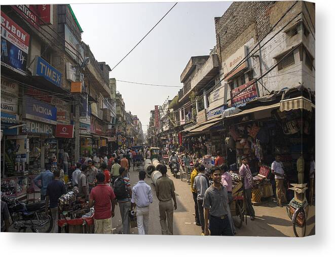 Crowded Canvas Print featuring the photograph Paharganj by Sonny Marcyan