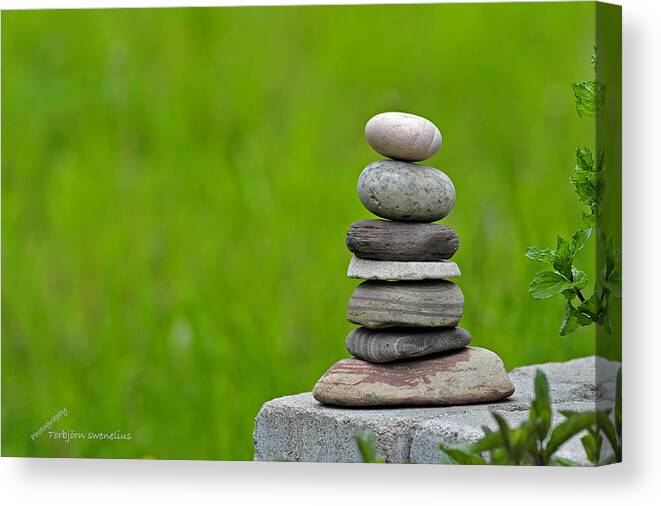 Piled Stones Canvas Print featuring the photograph Piled Stones by Torbjorn Swenelius