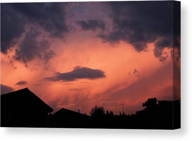 Suburb Canvas Print featuring the photograph Purple Clouds Gather In A Pink Sky Above Dark Houses by Photodisc